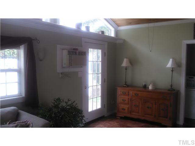 313 Pine Tree Road Oxford, NC 27565 - Photo 7 of 17 Family/sunroom has gas fireplace but also has this window heat and air unit