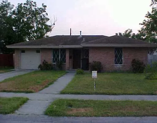 a view of a yard in front view of a house