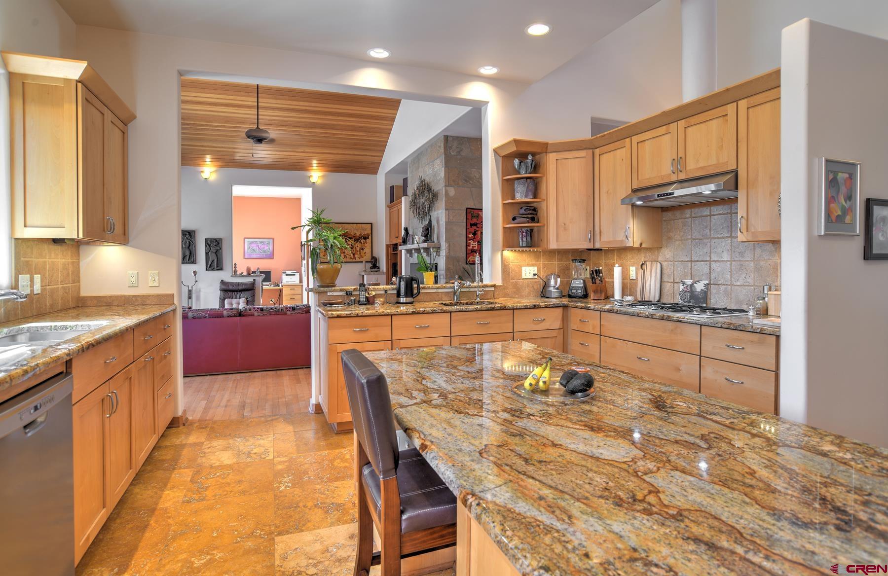 95 Puma Place Durango, CO 81301 - Photo 13 of 45 a kitchen with granite countertop lots of counter top space and living room