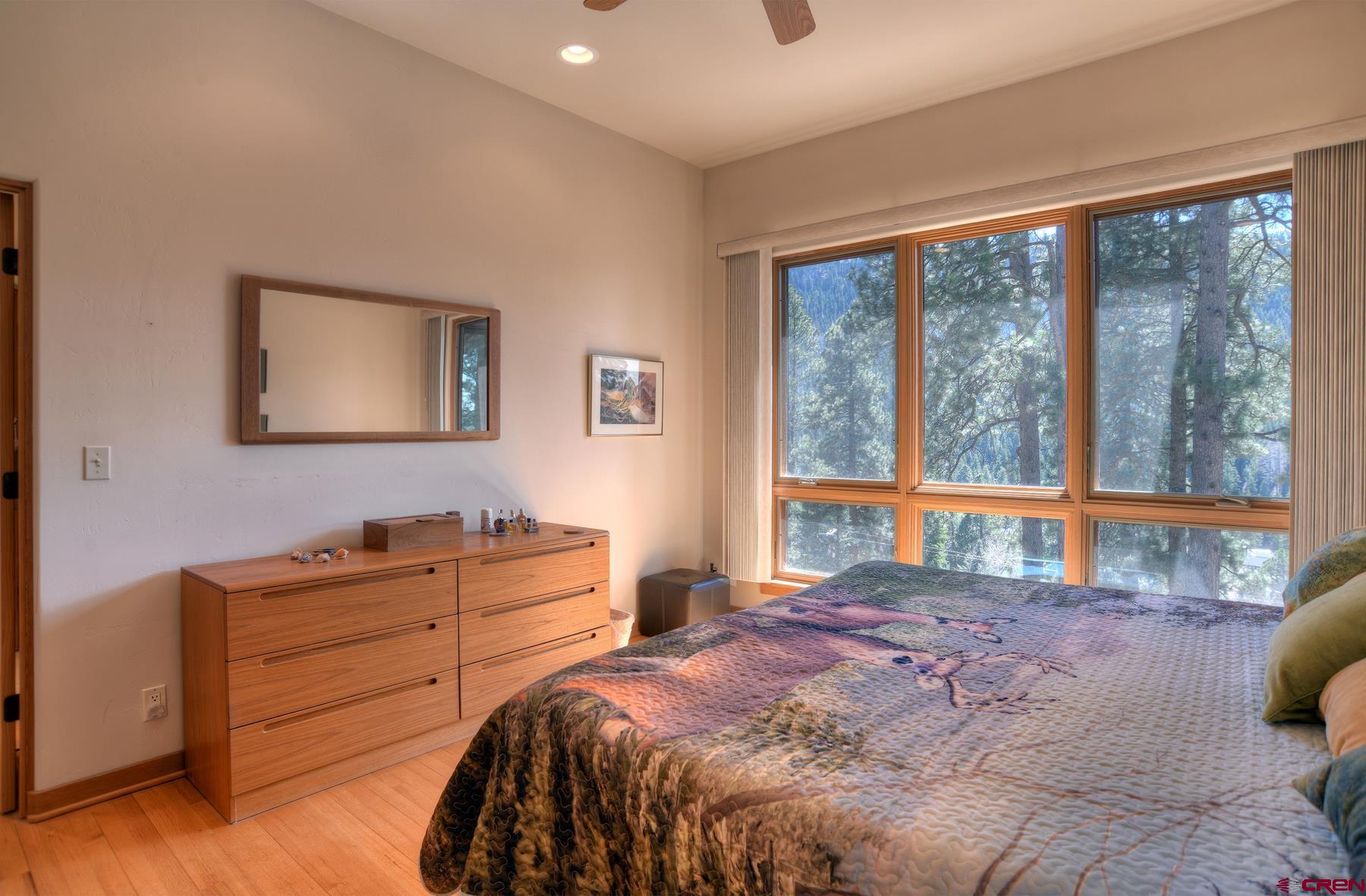 95 Puma Place Durango, CO 81301 - Photo 17 of 45 a bedroom with a bed and a large window