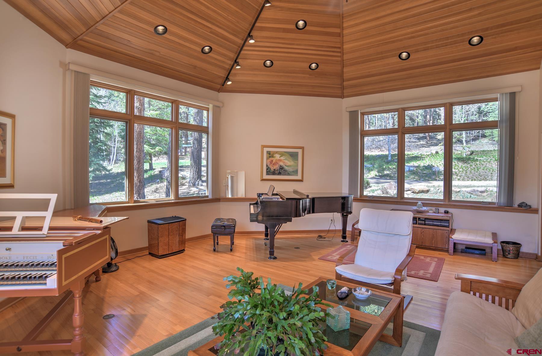 95 Puma Place Durango, CO 81301 - Photo 24 of 45 a living room with fireplace furniture and a large window