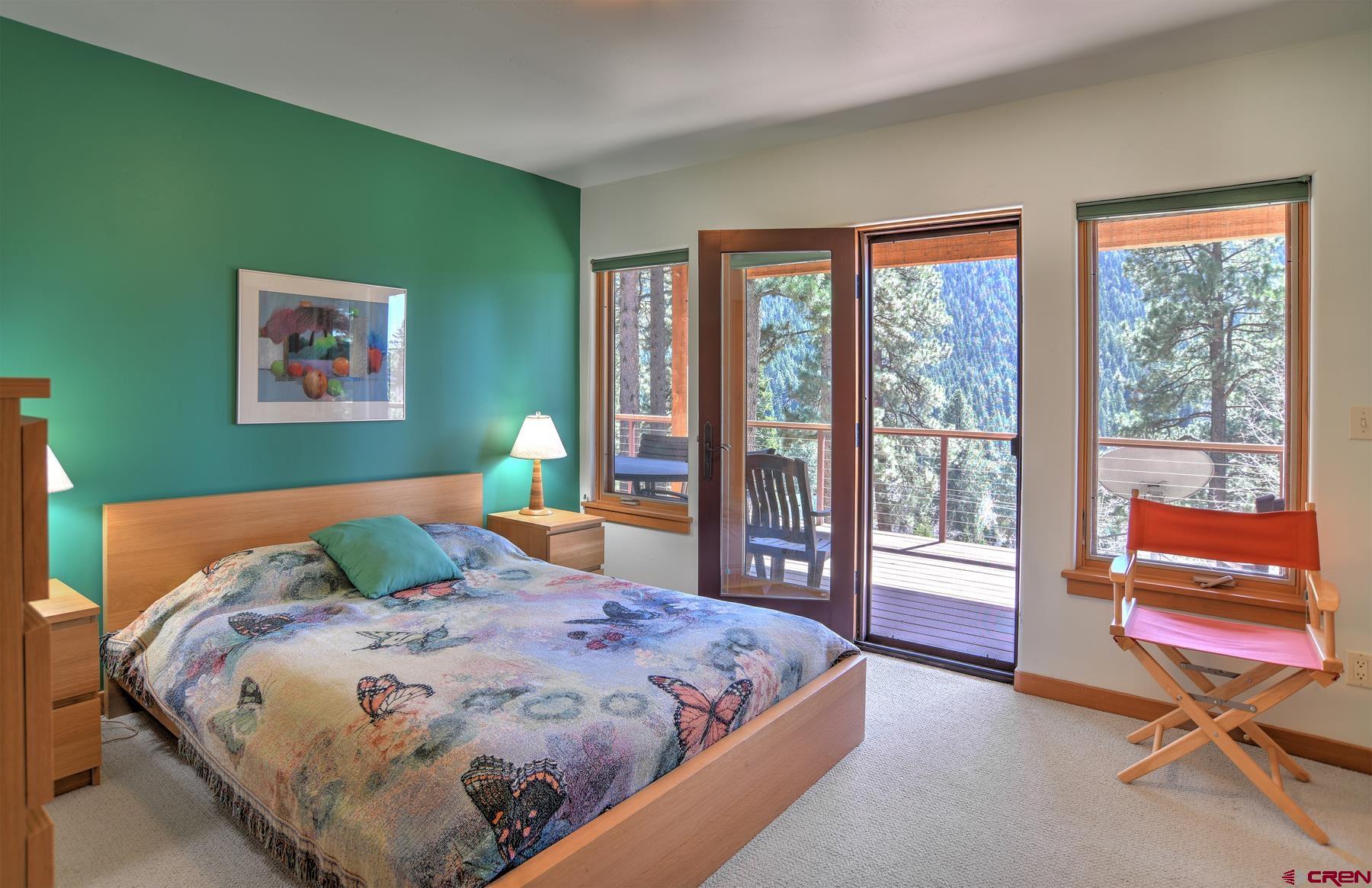 95 Puma Place Durango, CO 81301 - Photo 28 of 45 a bedroom with a bed and a large window