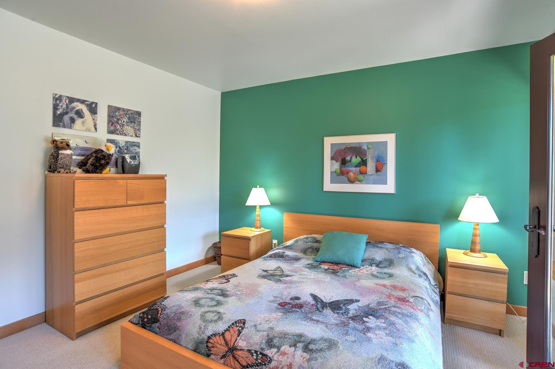 95 Puma Place Durango, CO 81301 - Photo 29 of 45 a bedroom with a bed and a dresser