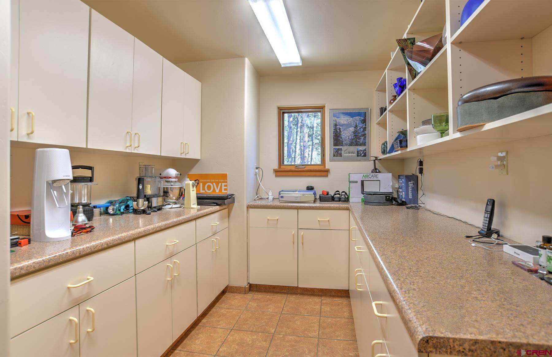 95 Puma Place Durango, CO 81301 - Photo 36 of 45 a kitchen with white cabinets and sink