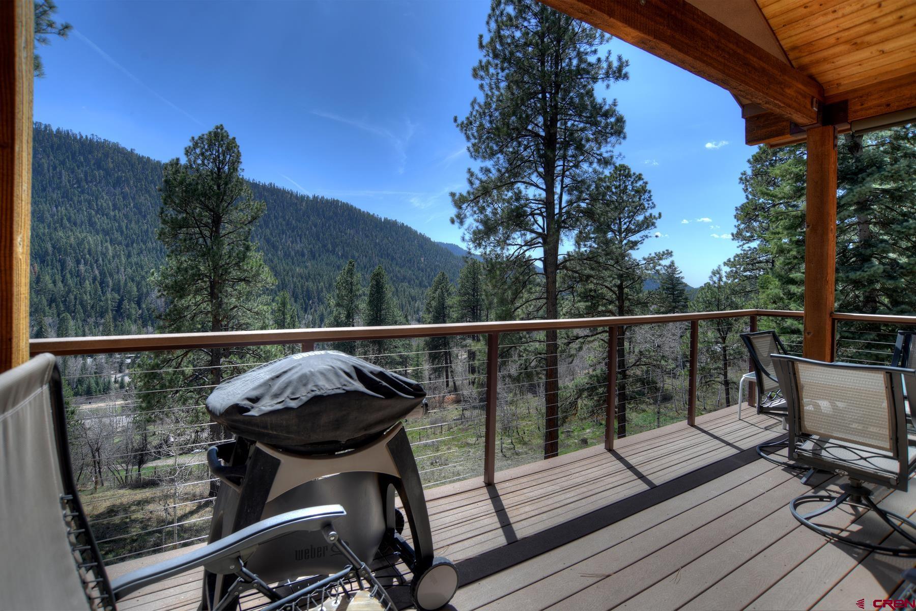 95 Puma Place Durango, CO 81301 - Photo 41 of 45 a view of a balcony with chairs and wooden floor