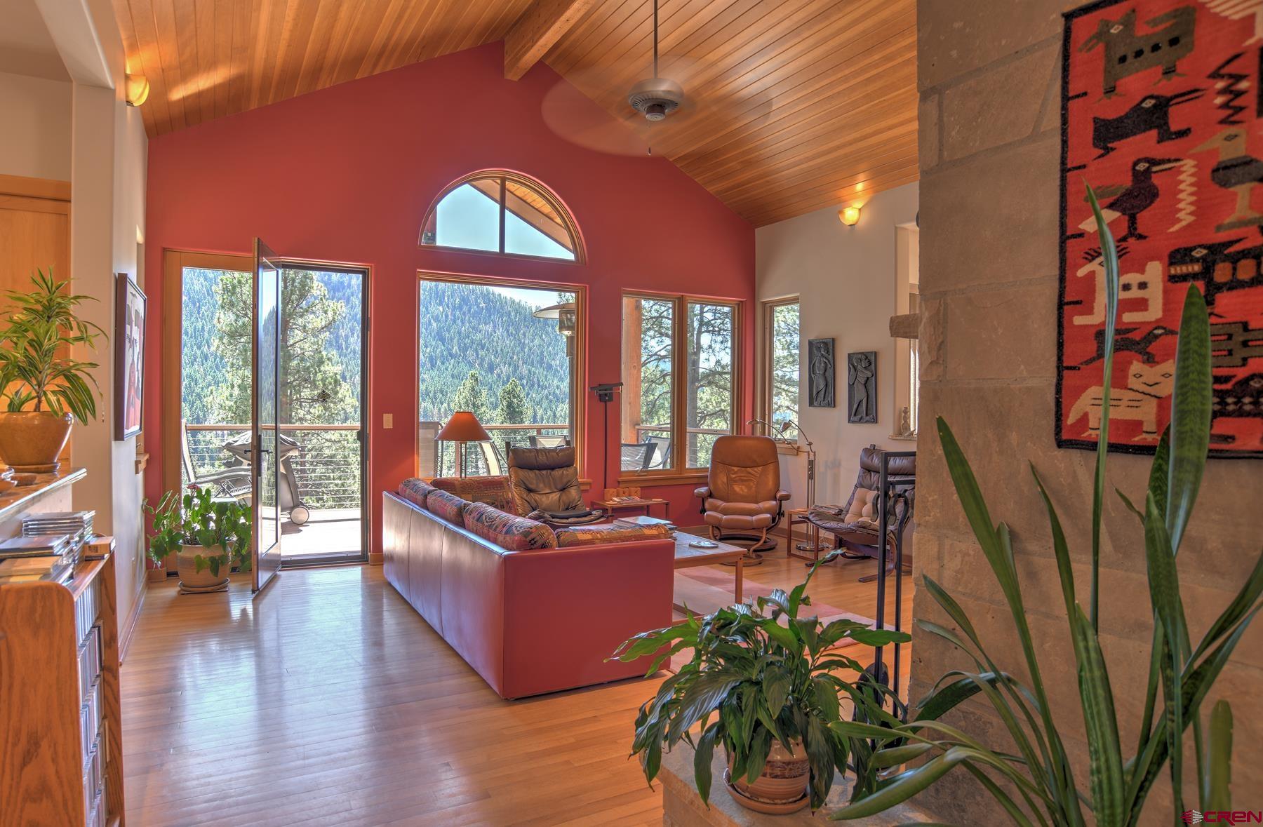 95 Puma Place Durango, CO 81301 - Photo 7 of 45 a living room with furniture floor to ceiling window and wooden floor