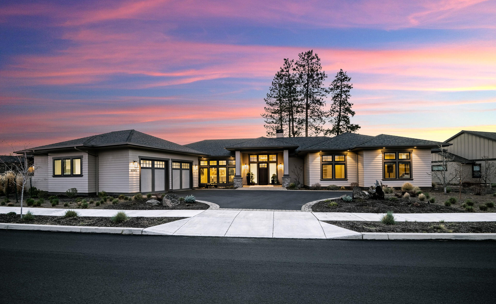 60871 River Rim Drive Bend, OR 97702 - Photo 7 of 42 a front view of a house with a yard