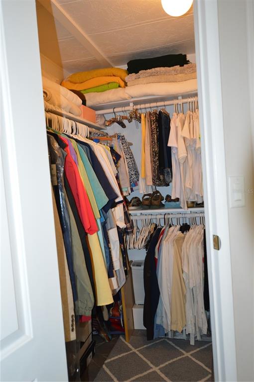 140 Rarotonga Road North Port, FL 34287 - Photo 20 of 42 a view of walk in closet with clothes and shoes