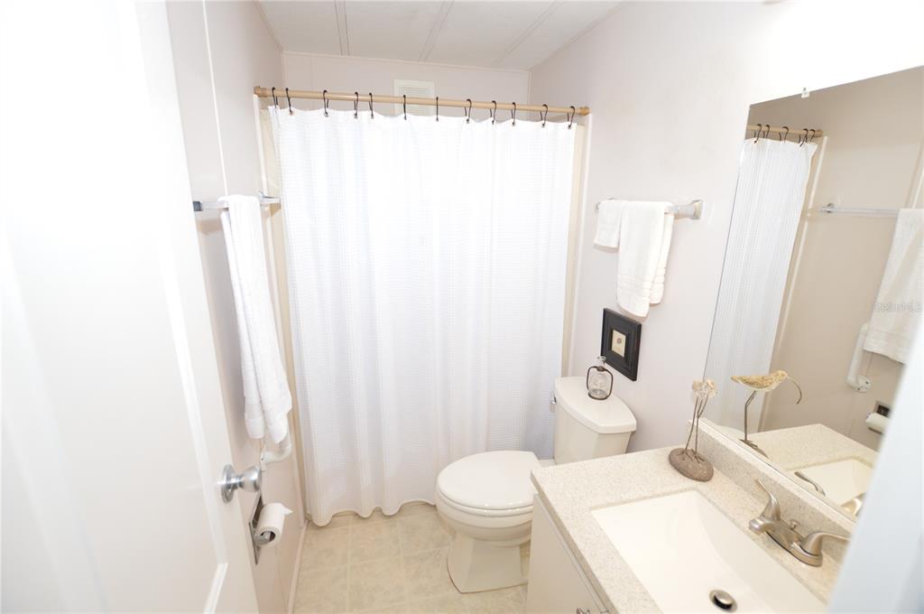 140 Rarotonga Road North Port, FL 34287 - Photo 23 of 42 a bathroom with a sink toilet and shower