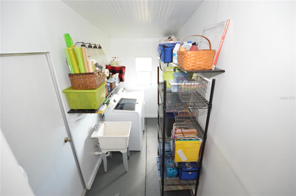140 Rarotonga Road North Port, FL 34287 - Photo 24 of 42 a living room with furniture and a window