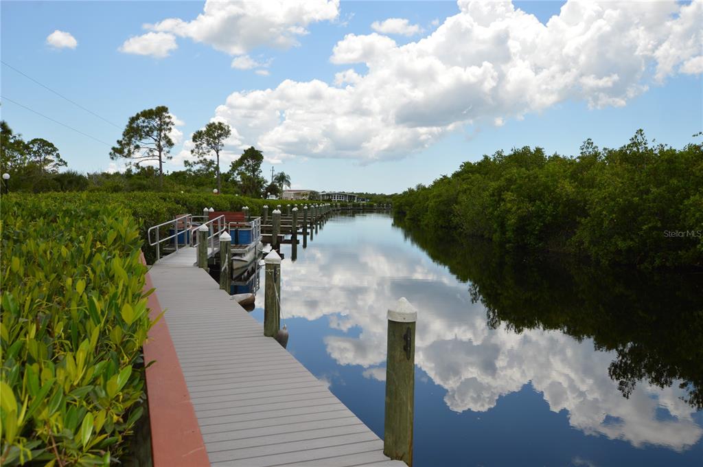 140 Rarotonga Road North Port, FL 34287 - Photo 26 of 42 a view of a lake with a yard