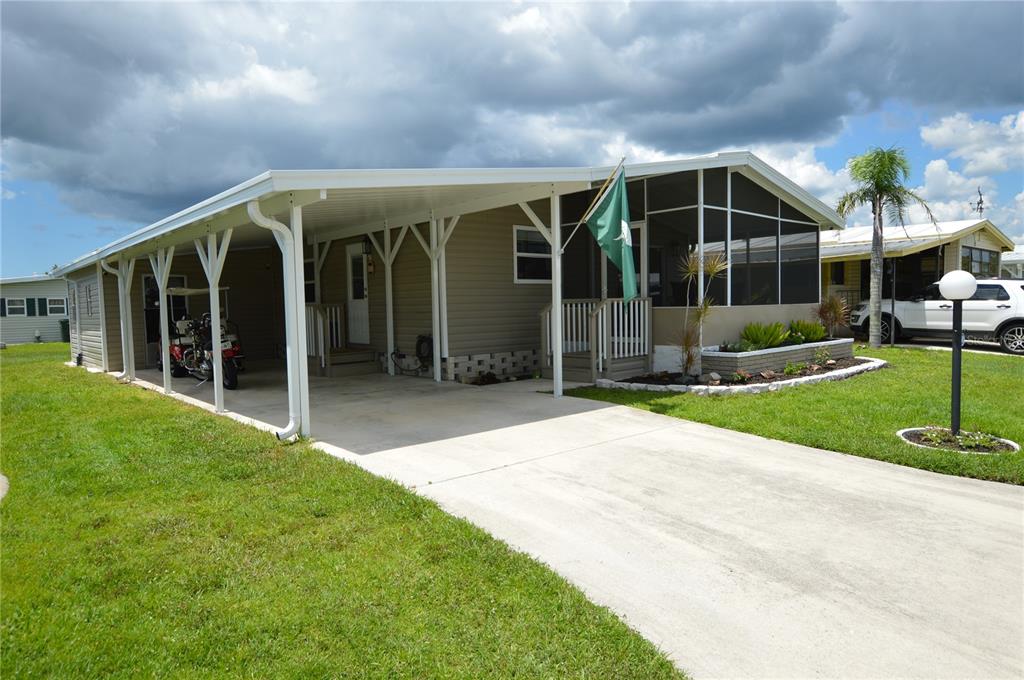 140 Rarotonga Road North Port, FL 34287 - Photo 3 of 42 a view of a house with backyard and porch