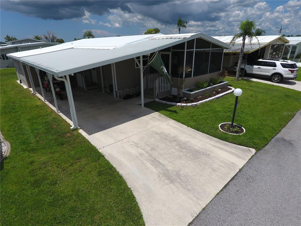 140 Rarotonga Road North Port, FL 34287 - Photo 31 of 42 a garden view with a seating space