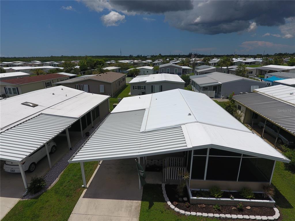 140 Rarotonga Road North Port, FL 34287 - Photo 33 of 42 a terrace of a house with wooden floor and city view