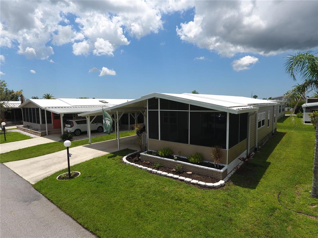 140 Rarotonga Road North Port, FL 34287 - Photo 34 of 42 a view of an empty room with a big yard and large trees