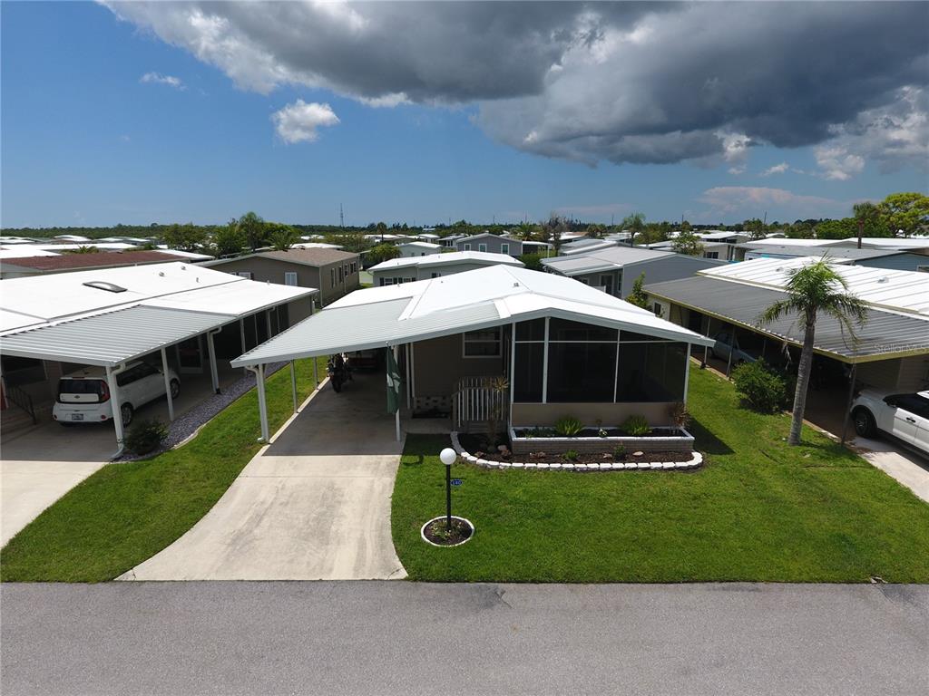 140 Rarotonga Road North Port, FL 34287 - Photo 35 of 42 a front view of a house with garden