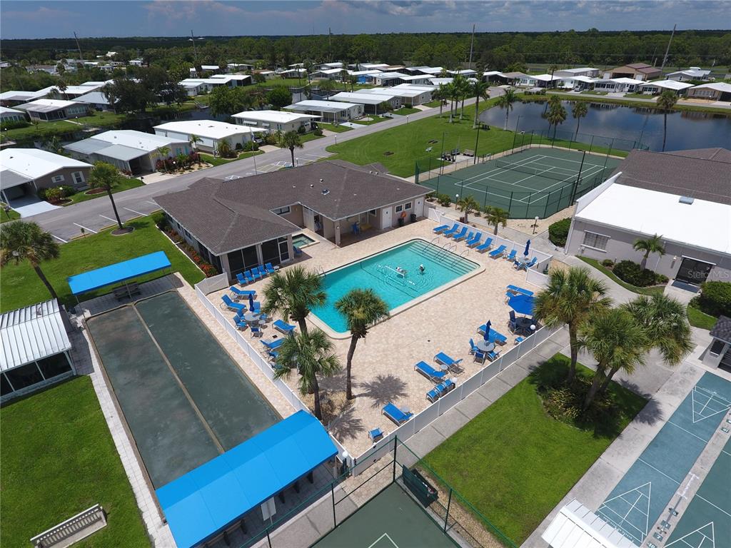 140 Rarotonga Road North Port, FL 34287 - Photo 40 of 42 an aerial view of a pool yard patio and outdoor seating