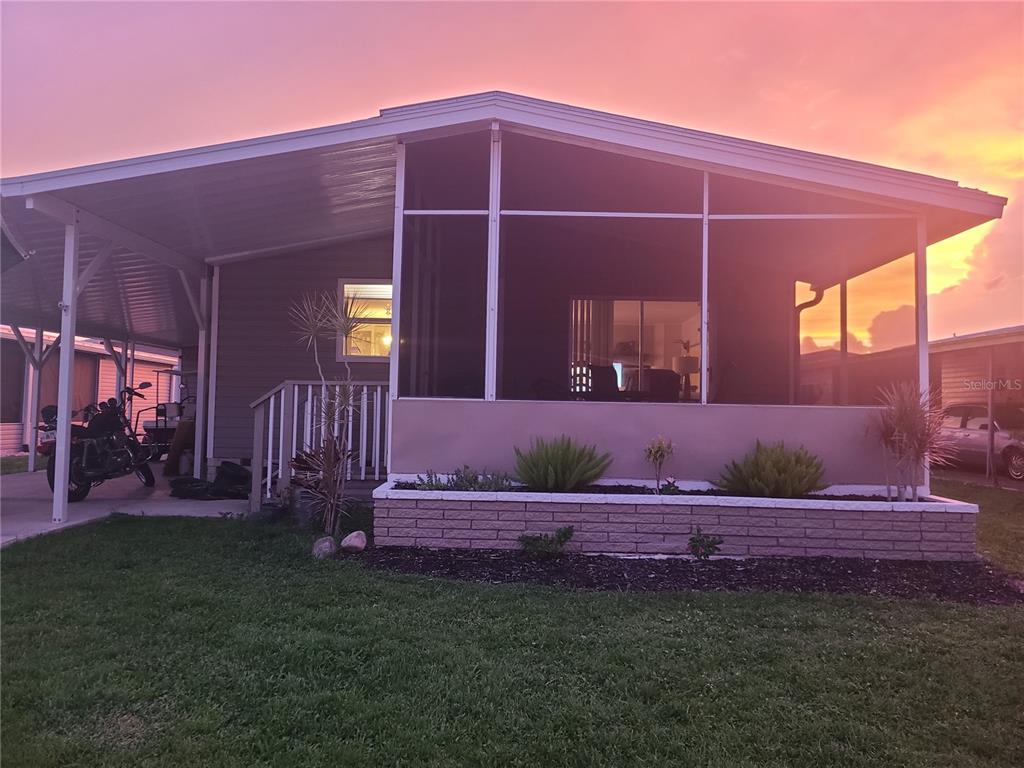 140 Rarotonga Road North Port, FL 34287 - Photo 42 of 42 a front view of a house with garden
