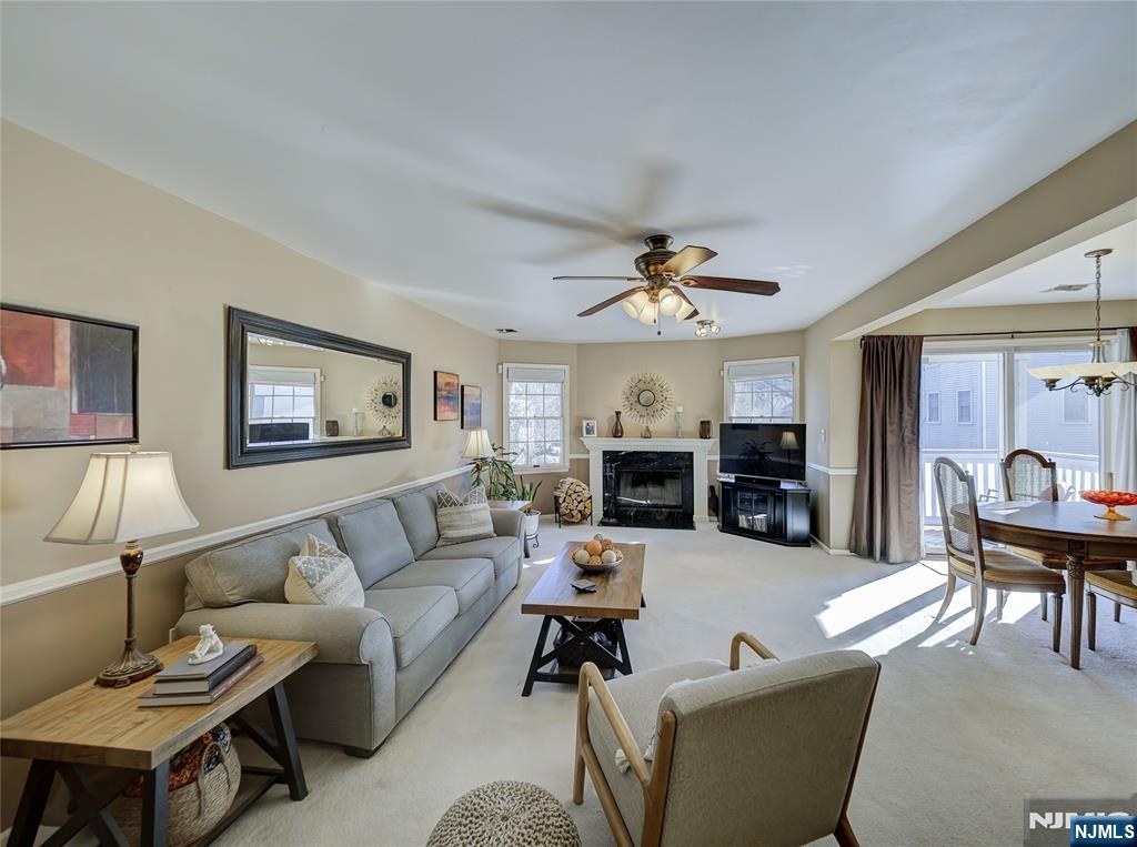 101 Quartz Lane Paterson, NJ 07501 - Photo 16 of 34 a living room with furniture and a chandelier