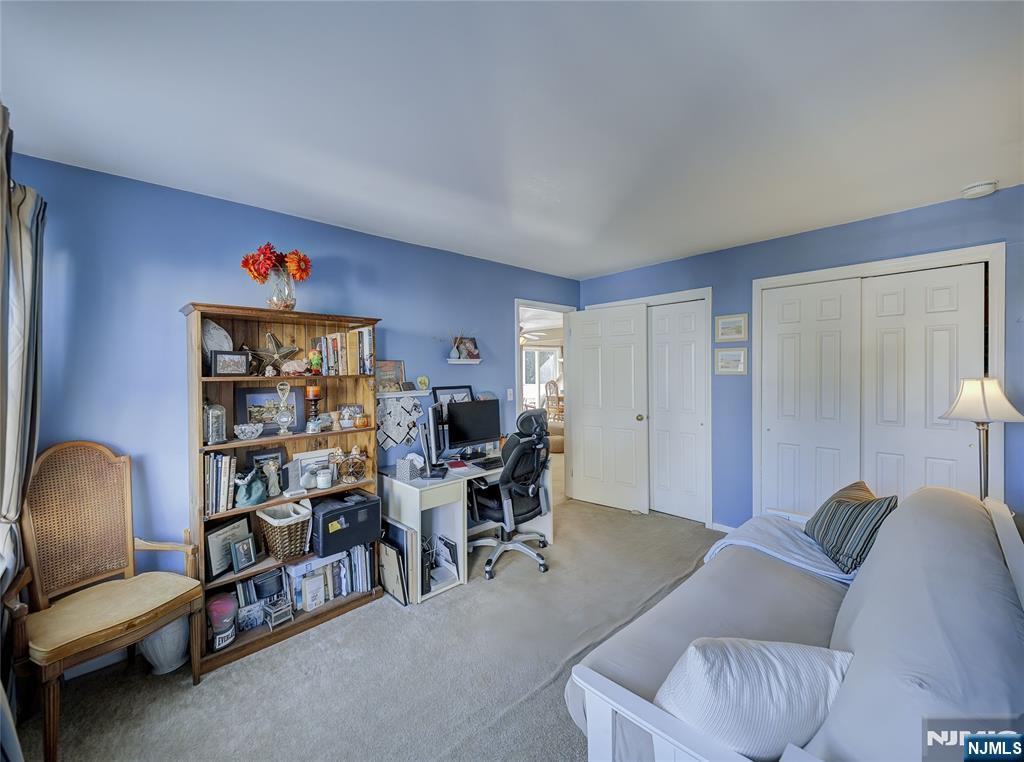 101 Quartz Lane Paterson, NJ 07501 - Photo 24 of 34 a living room with furniture and a chair