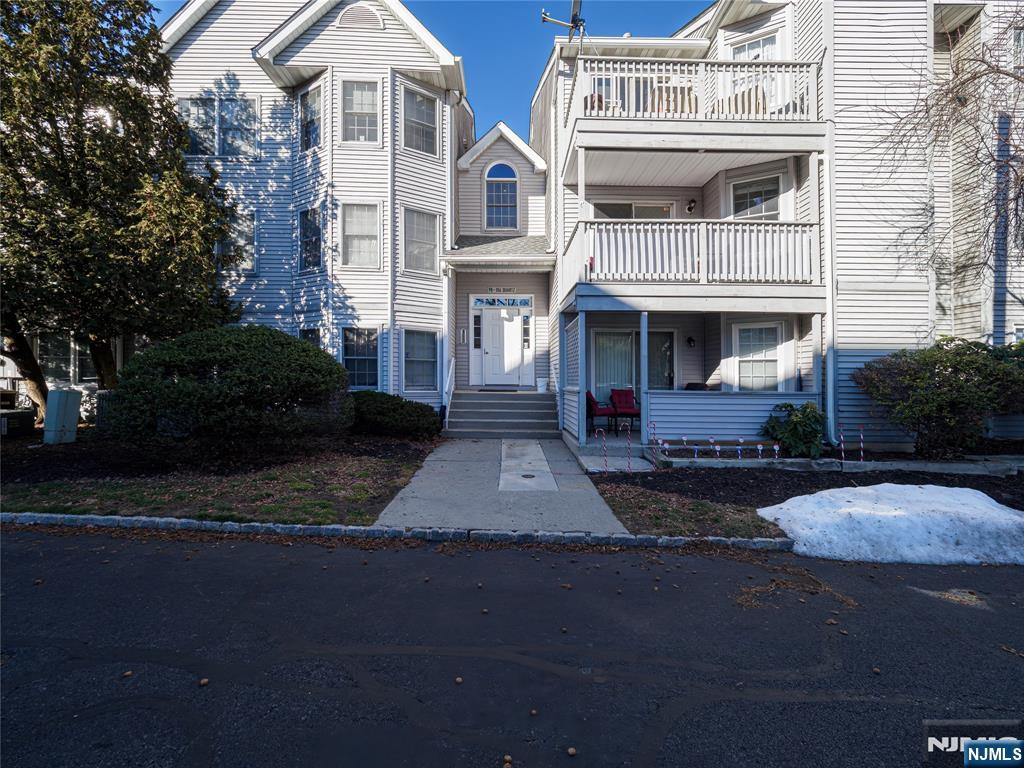 101 Quartz Lane Paterson, NJ 07501 - Photo 4 of 34 a front view of a house with yard