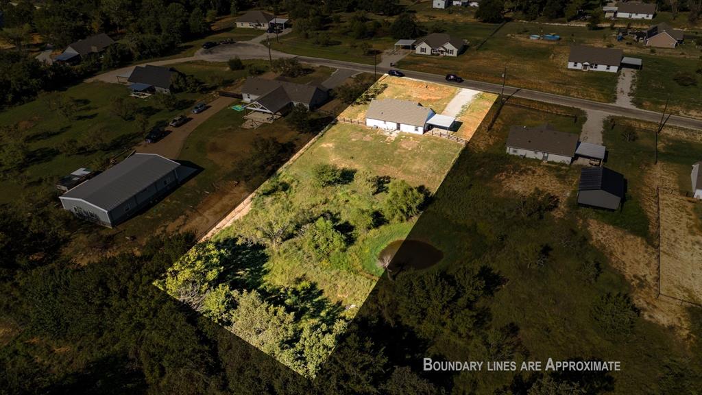 509 Pecan Tree Court Poolville, TX 76487 - Photo 2 of 25 an aerial view of a house