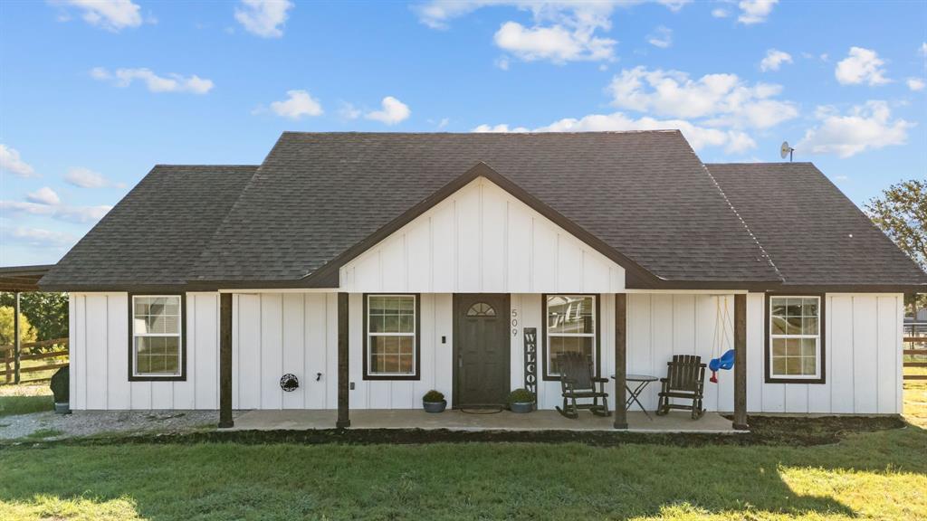 509 Pecan Tree Court Poolville, TX 76487 - Photo 21 of 25 front view of a house with a yard