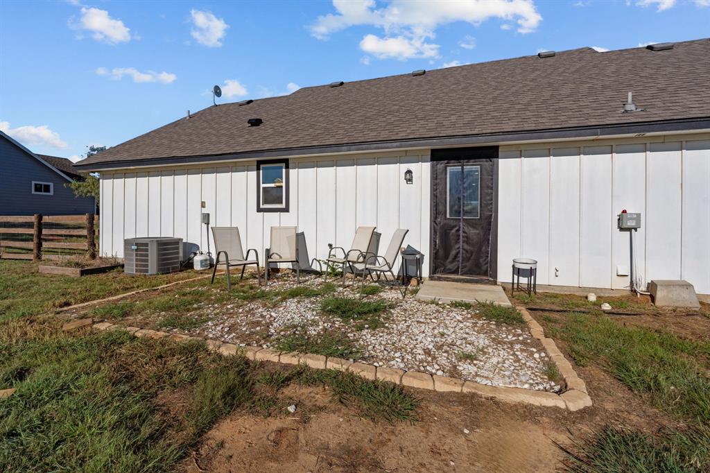 509 Pecan Tree Court Poolville, TX 76487 - Photo 24 of 25 a view of a house with backyard