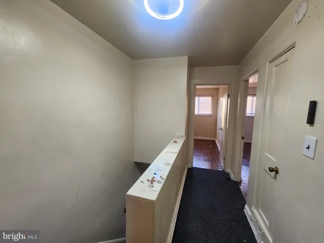 a view of an entryway with wooden floor