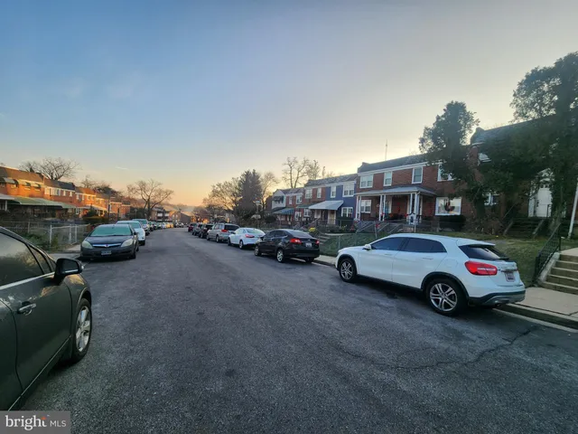 a car parked in parking lot with cars parked