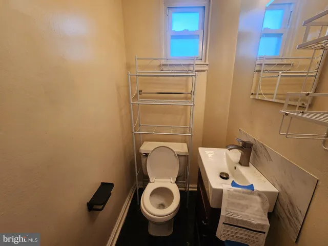 a bathroom with a toilet and a sink