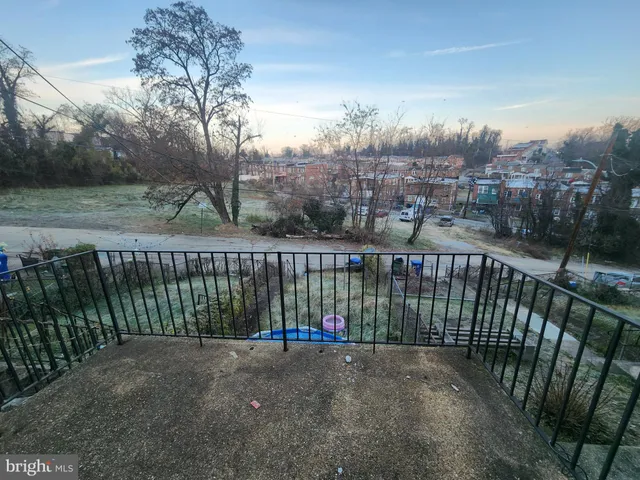 a view of a wrought iron fences in front of house