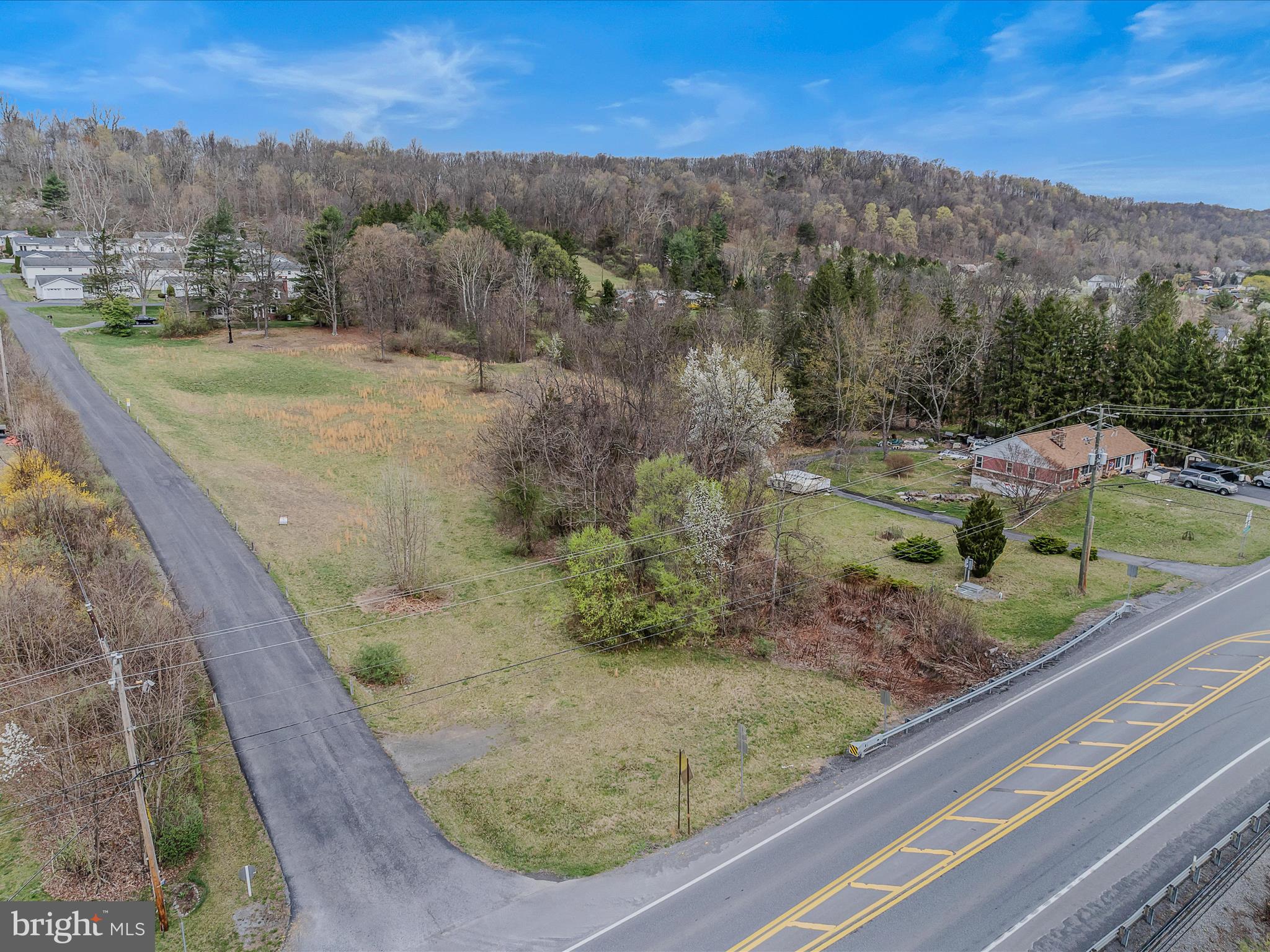 2218 Valley Road Berkeley Springs, WV 25411 - Photo 11 of 32 a view of a wooden floor with a mountain in the background