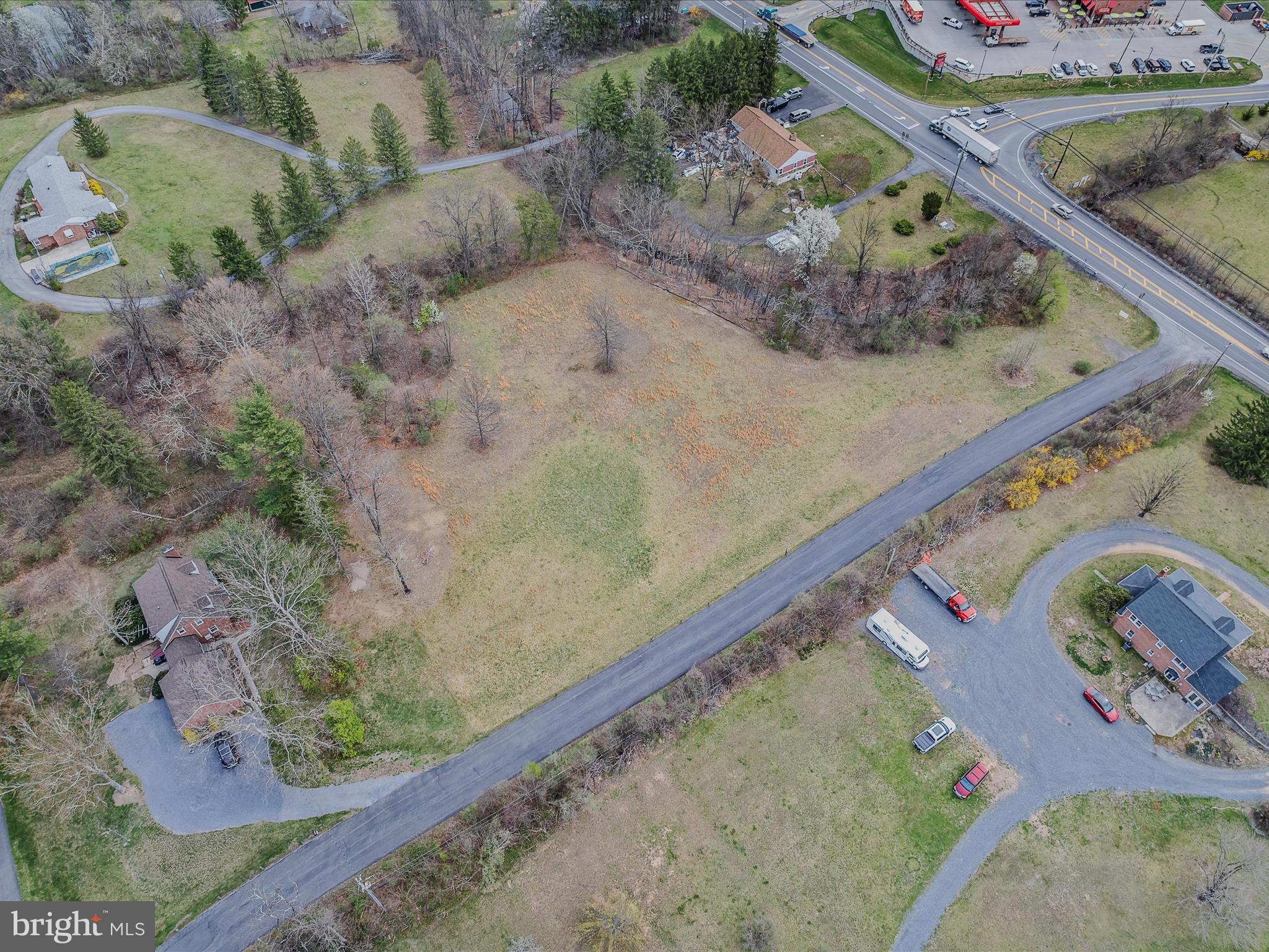 2218 Valley Road Berkeley Springs, WV 25411 - Photo 24 of 32 a view of a garden with a bench