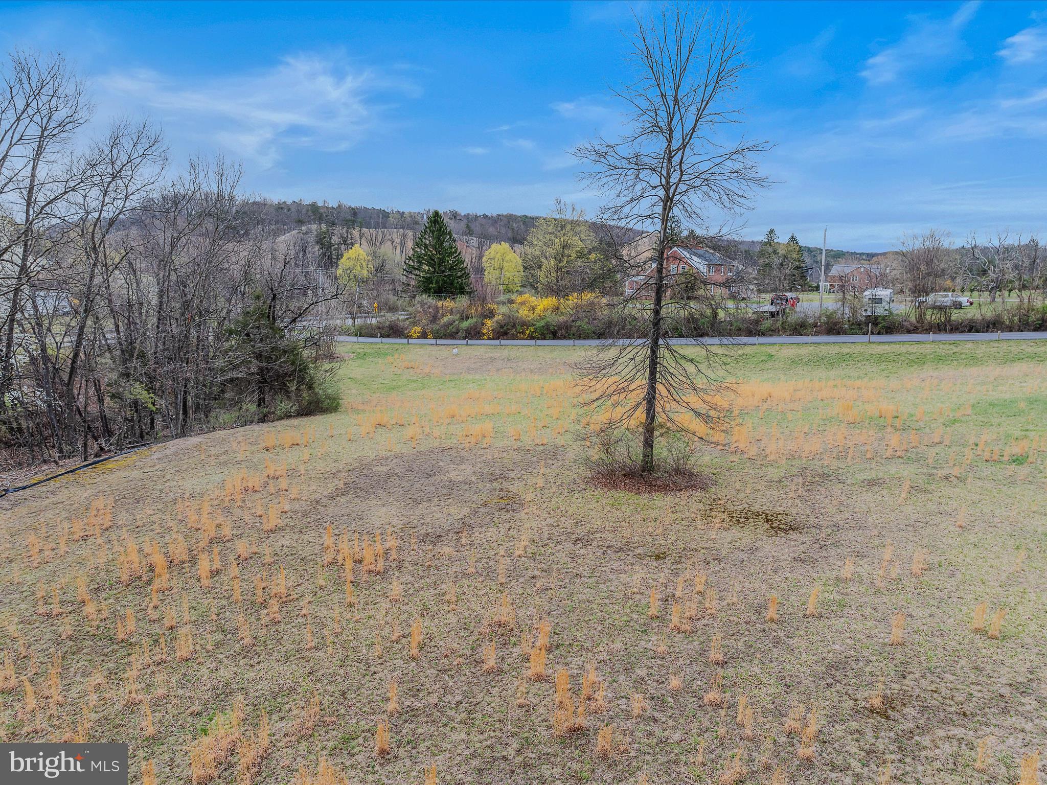 2218 Valley Road Berkeley Springs, WV 25411 - Photo 6 of 32 a view of a street with a yard