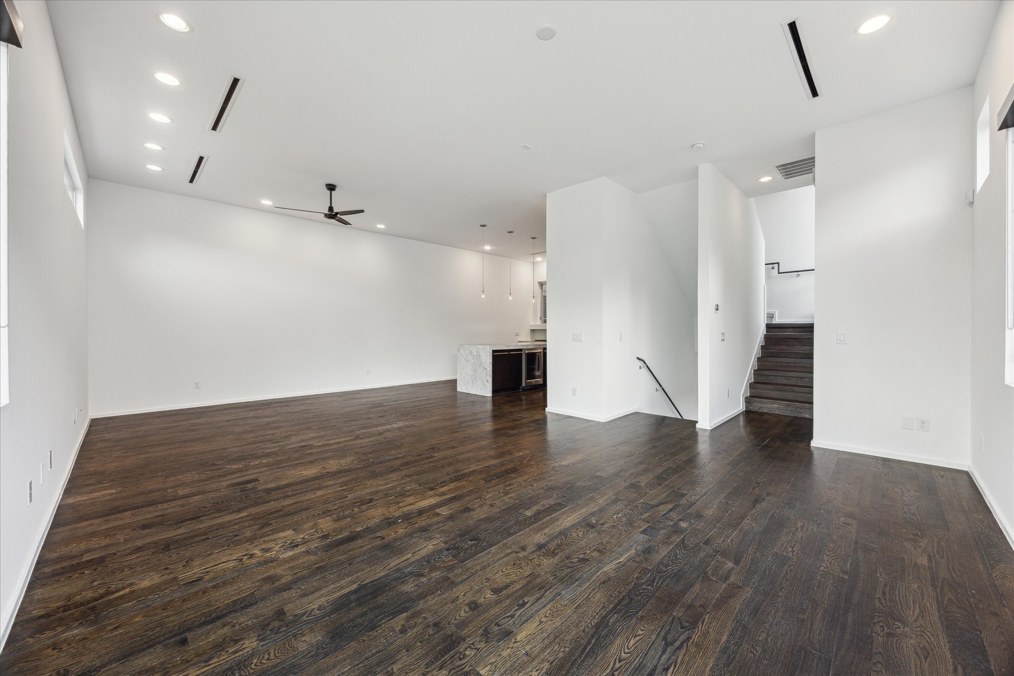 1728 Michigan Street, Unit A Houston, TX 77006 - Photo 10 of 38 a view of an empty room with wooden floor and a window