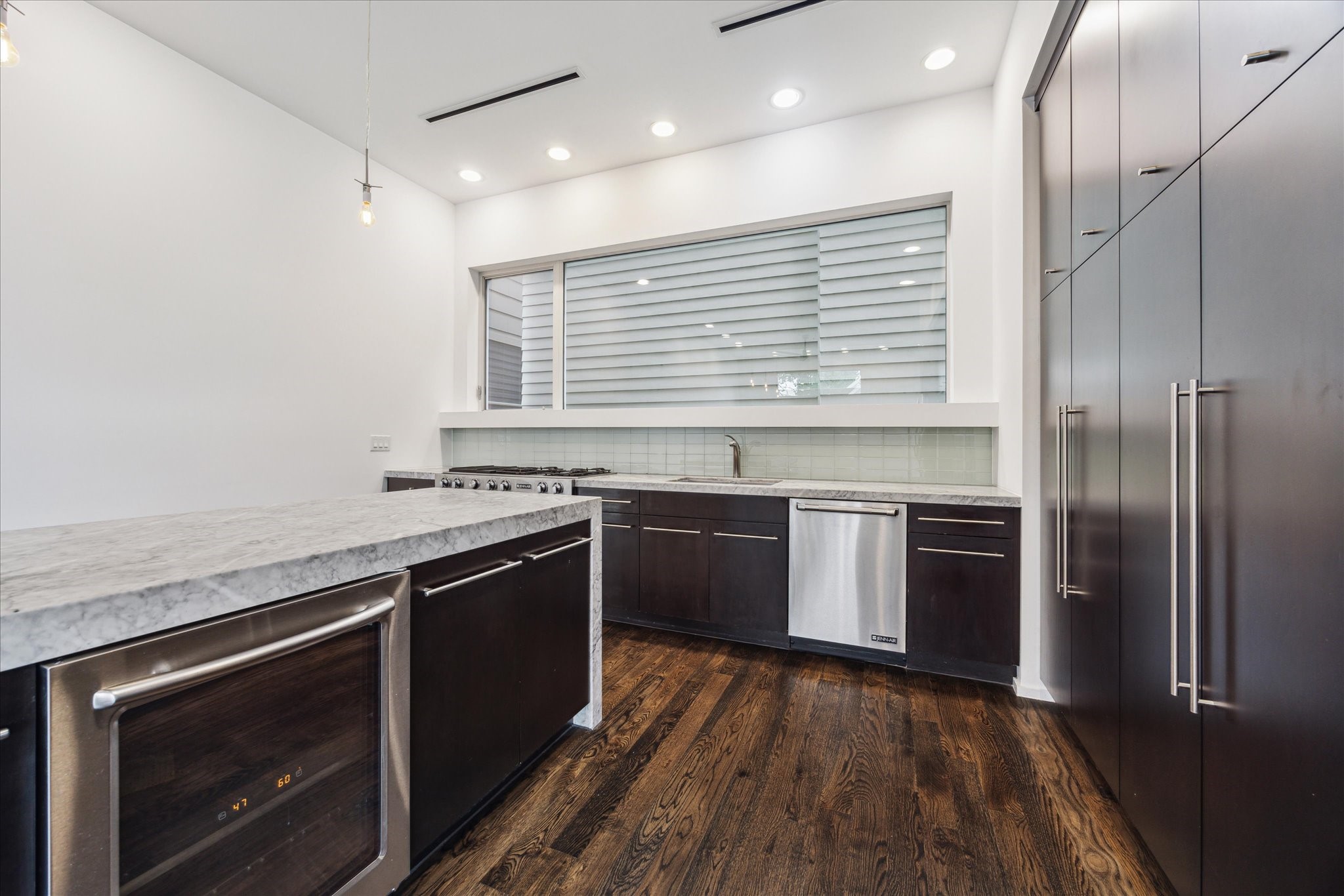 1728 Michigan Street, Unit A Houston, TX 77006 - Photo 15 of 38 a kitchen with stainless steel appliances granite countertop a stove and a refrigerator