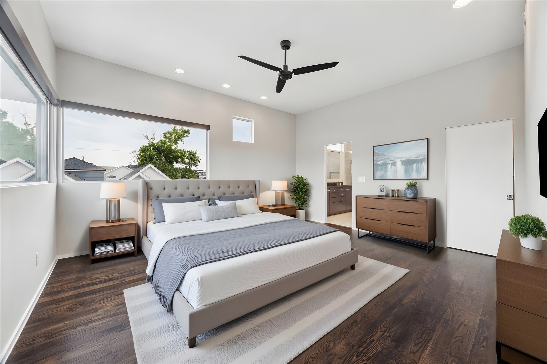 1728 Michigan Street, Unit A Houston, TX 77006 - Photo 16 of 38 a spacious bedroom with a bed a couch and a potted plant