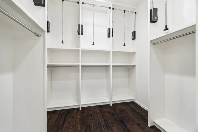 a bedroom with a bed and a walk in closet