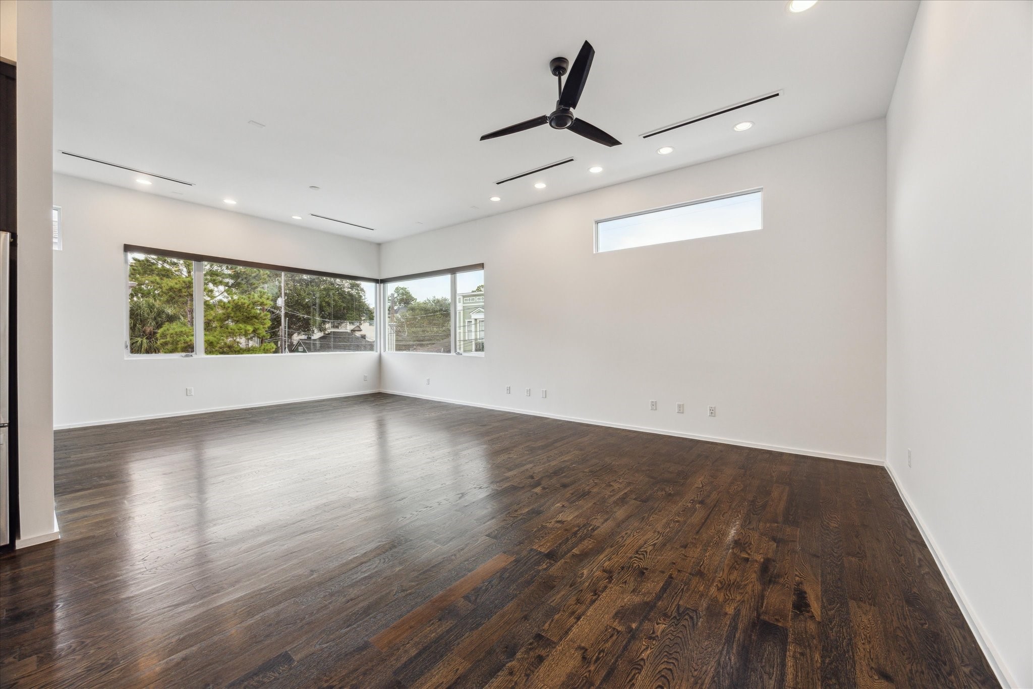 1728 Michigan Street, Unit A Houston, TX 77006 - Photo 8 of 38 a view of empty room with wooden floor and fan