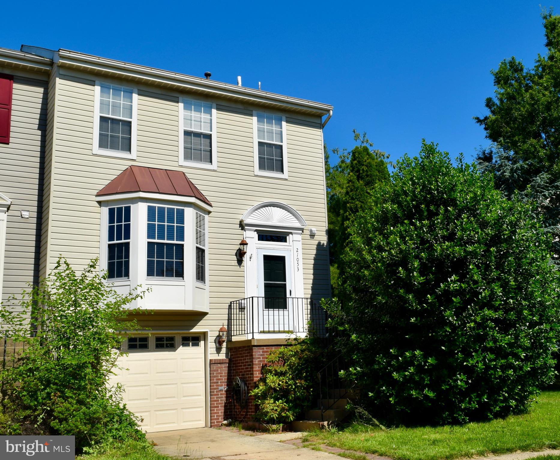 21053 Cornerpost Square Ashburn, VA 20147 - Photo 1 of 9 Front exterior - end unit, 1 car garage