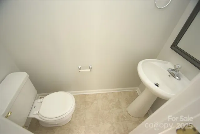 a bathroom with a toilet and a sink