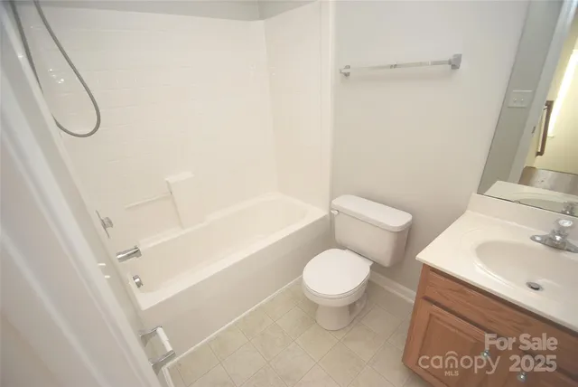 a bathroom with a toilet sink and shower
