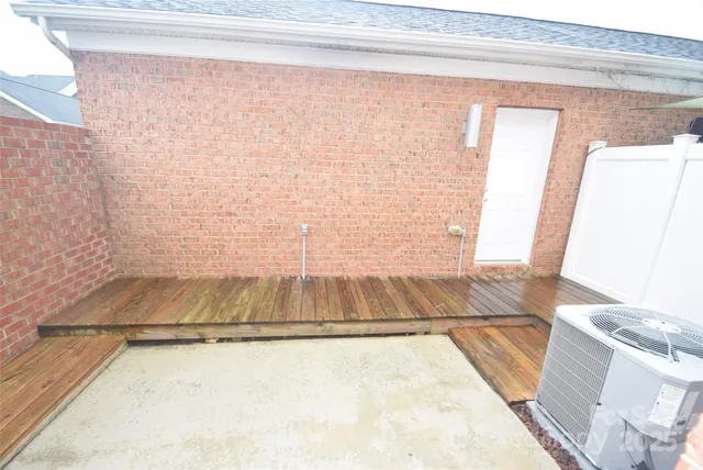 a view of a brick house with many windows