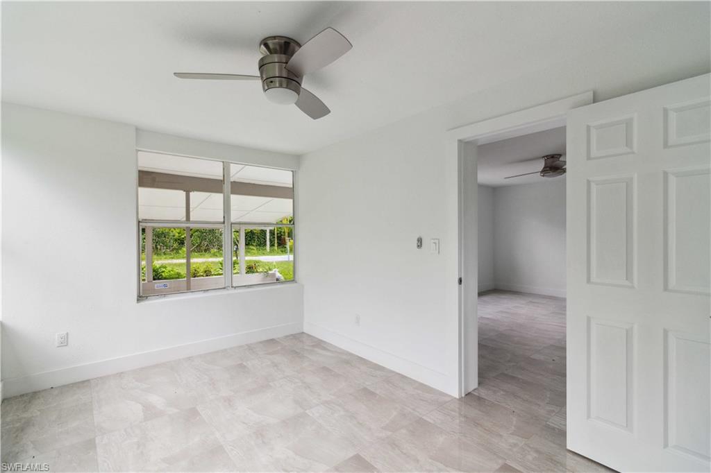 1102 East Bougainvillea Road Lehigh Acres, FL 33936 - Photo 11 of 28 an empty room with windows