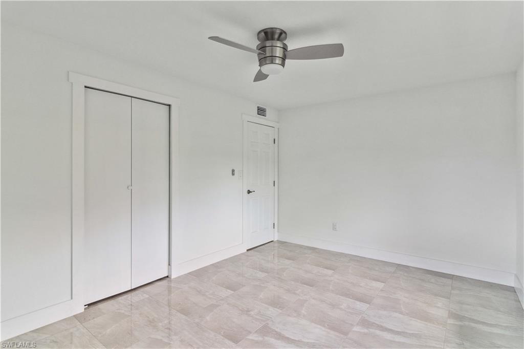 1102 East Bougainvillea Road Lehigh Acres, FL 33936 - Photo 19 of 28 wooden floor in an empty room