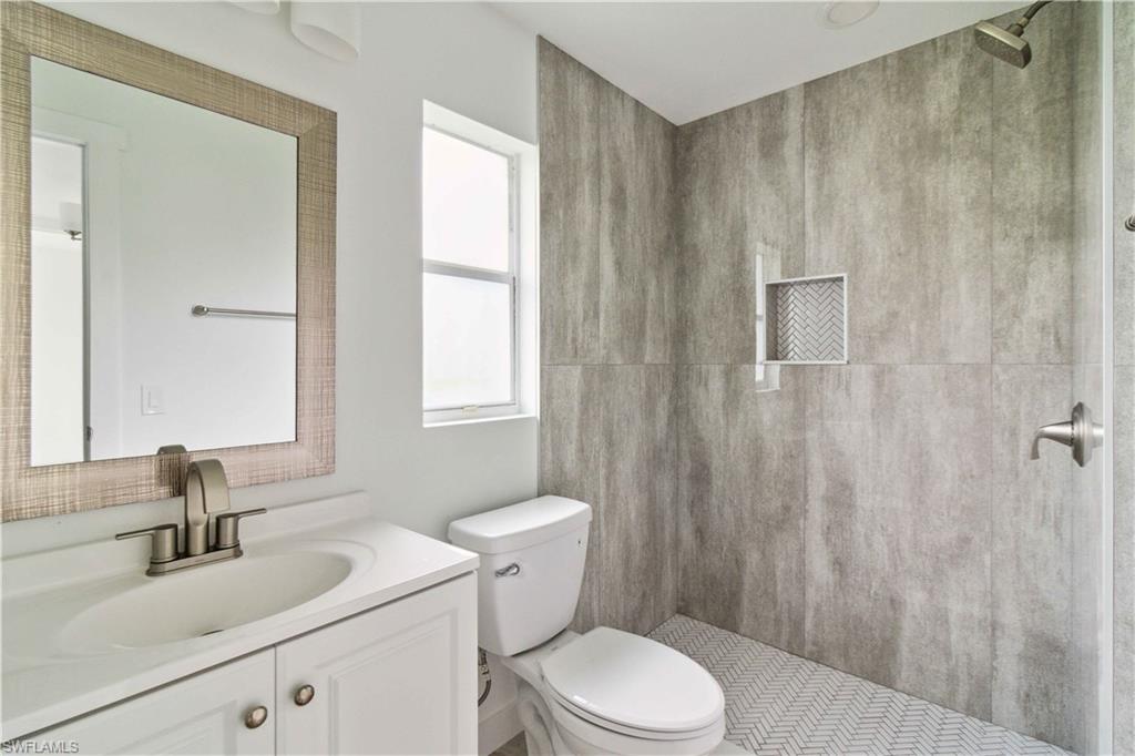 1102 East Bougainvillea Road Lehigh Acres, FL 33936 - Photo 25 of 28 a bathroom with a sink a toilet and shower