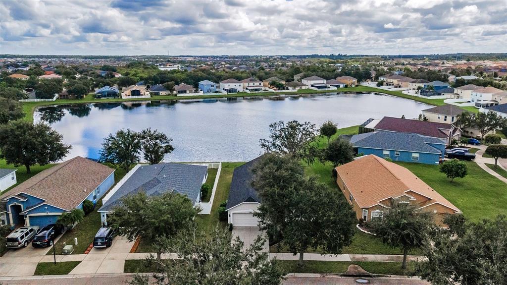13561 Fladgate Mark Drive Riverview, FL 33579 - Photo 2 of 65 an aerial view of residential houses with outdoor space and lake view