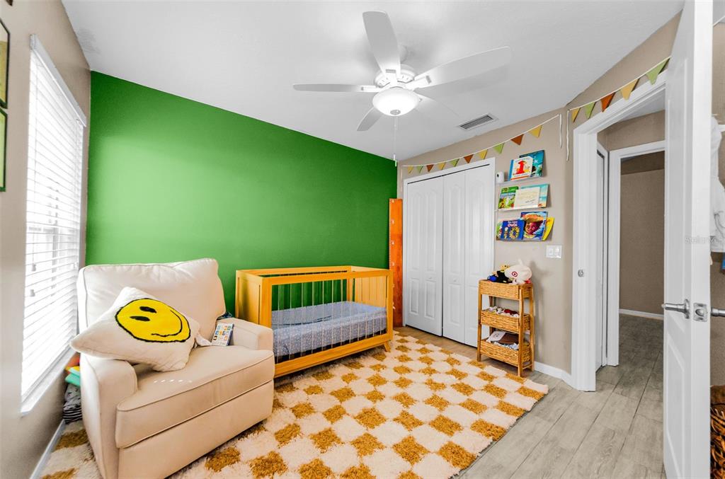 13561 Fladgate Mark Drive Riverview, FL 33579 - Photo 30 of 65 a bedroom with a bed and a window