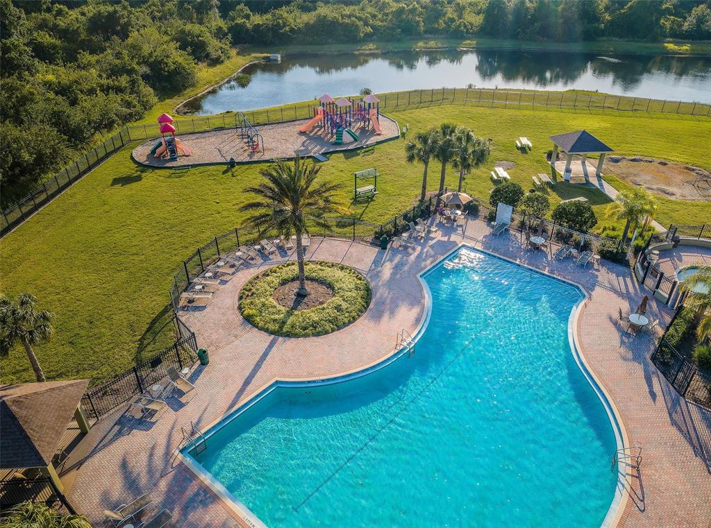 13561 Fladgate Mark Drive Riverview, FL 33579 - Photo 48 of 65 an aerial view of a pool patio swimming pool and outdoor seating